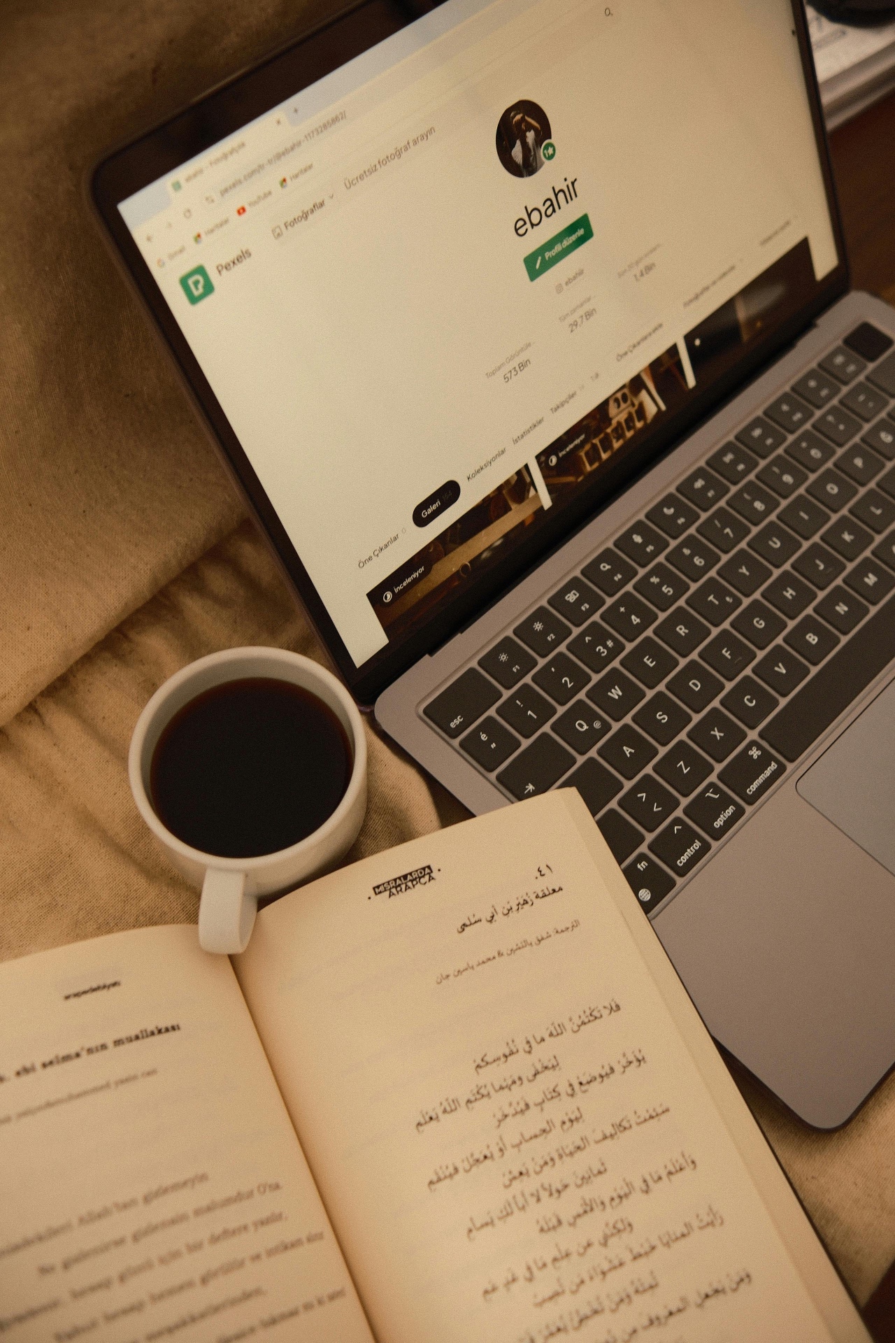Arabic book and laptop